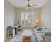 Comfortable home office with a sofa, natural light, and a ceiling fan at 339 Marsh Creek Rd, Venice, FL 34292