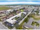 Aerial view of the condo complex near commercial airport and neighboring streets at 400 Base E Ave # 213, Venice, FL 34285