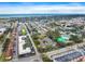 Wide aerial shot of the condo complex near a residential neighborhood and the ocean at 400 Base E Ave # 213, Venice, FL 34285
