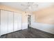 View of a bedroom with a closet and an open doorway to another room at 400 Base E Ave # 213, Venice, FL 34285