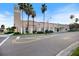 Street view of the Venice Theatre with unique architecture and landscaping at 400 Base E Ave # 213, Venice, FL 34285