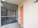 Close up of ground floor condo patio and exterior wall at 400 Base E Ave # 213, Venice, FL 34285