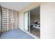 Covered outdoor patio features a sliding glass door into the living area of the condo at 400 Base E Ave # 213, Venice, FL 34285