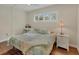 Bedroom with a double bed, bedside tables and a window with white shutters at 409 Manatee Ct # 104, Venice, FL 34285