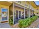 View of the charming patio showing the table set, chairs, and string lights at 409 Manatee Ct # 104, Venice, FL 34285