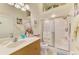 Well-maintained bathroom featuring a glass-enclosed shower, vanity, and ample decor at 4301 Nizza Ct, Venice, FL 34293