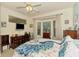 Cozy bedroom with lots of natural light and a pretty peacock-themed comforter at 4301 Nizza Ct, Venice, FL 34293
