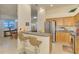 Modern kitchen featuring stainless steel appliances and adjacent dining area at 4301 Nizza Ct, Venice, FL 34293