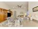 Open-concept kitchen featuring a breakfast bar and seamless transition to the living room at 4301 Nizza Ct, Venice, FL 34293