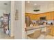 View of an open kitchen and breakfast bar, leading to the dining and living areas at 4301 Nizza Ct, Venice, FL 34293