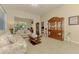 Inviting living room area with tile floors, neutral paint, and a sliding glass door to the lanai at 4301 Nizza Ct, Venice, FL 34293