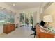 Bright office space with tile flooring, a large window, and a sliding glass door to the backyard patio at 4301 Nizza Ct, Venice, FL 34293