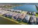Aerial view of a lakefront community with beautiful homes, some having a screened-in pool at 448 Bocelli Dr, Nokomis, FL 34275