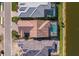 Aerial view highlighting backyard pools and tile roofs of homes near the lake at 448 Bocelli Dr, Nokomis, FL 34275