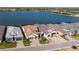 Aerial view of homes showcasing well-maintained lawns, tile roofs and scenic water views at 448 Bocelli Dr, Nokomis, FL 34275
