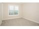 Empty bedroom with neutral carpet, plantation shutters and white trim at 448 Bocelli Dr, Nokomis, FL 34275