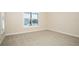 Cozy bedroom featuring carpet floors, bright paint and lake view at 448 Bocelli Dr, Nokomis, FL 34275