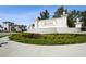 Beautiful entrance sign to Aria community with elegant landscaping and manicured grounds at 448 Bocelli Dr, Nokomis, FL 34275