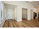 Bright foyer with hardwood floors, a white front door, and views into adjacent rooms at 448 Bocelli Dr, Nokomis, FL 34275