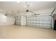 Spacious three car garage with epoxy flooring offers ample parking and storage at 448 Bocelli Dr, Nokomis, FL 34275