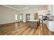 Open floor plan combining a kitchen with a large island, stainless steel appliances, and ample natural light at 448 Bocelli Dr, Nokomis, FL 34275