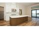 Well-appointed kitchen featuring a large island, stainless steel appliances, and sleek cabinetry at 448 Bocelli Dr, Nokomis, FL 34275