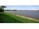 Scenic view of the tranquil lake enhances the natural beauty of the community at 448 Bocelli Dr, Nokomis, FL 34275