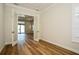Well-lit office featuring wood floors, bright paint and transom windows at 448 Bocelli Dr, Nokomis, FL 34275