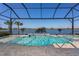 Beautiful screened pool with lake view, perfect for relaxing and entertaining outdoors at 448 Bocelli Dr, Nokomis, FL 34275