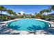 Community pool featuring shaded lounge areas and ample space to relax in the sun at 448 Bocelli Dr, Nokomis, FL 34275