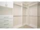 Spacious walk-in closet with custom shelving, drawers and metal rods at 448 Bocelli Dr, Nokomis, FL 34275