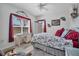 Bright bedroom with a queen-size bed, a desk near the window, and ample natural light at 4802 51St W St # 1816, Bradenton, FL 34210