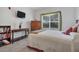 Comfortable bedroom with a large window, wooden furnishings, and stylish decor at 4802 51St W St # 1816, Bradenton, FL 34210