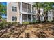 Well-maintained exterior elevation with a screened porch and manicured landscaping at 4802 51St W St # 1816, Bradenton, FL 34210