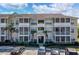 Condo building featuring multiple units with screened patios, well-maintained landscaping, and convenient parking at 4802 51St W St # 1816, Bradenton, FL 34210