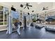 Gym with many windows, ceiling fans, and an assortment of exercise equipment at 4802 51St W St # 1816, Bradenton, FL 34210