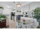 Cozy kitchen space with updated appliances, breakfast table, and a clear view into the living room at 4802 51St W St # 1816, Bradenton, FL 34210