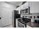 Modern kitchen with stainless steel appliances, granite countertops, and plenty of cabinet space at 4802 51St W St # 1816, Bradenton, FL 34210