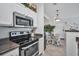 Well-lit kitchen with stainless steel appliances, granite countertops, tile flooring and an eat-in breakfast nook at 4802 51St W St # 1816, Bradenton, FL 34210