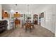 A dining room with a chandelier and a view to the kitchen and bedroom in the distance at 5458 Jessamine Ave, North Port, FL 34291