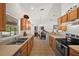 Bright kitchen features wood cabinets, neutral countertops, and stainless steel appliances at 5458 Jessamine Ave, North Port, FL 34291