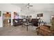 Comfortable living room with tile floors, neutral walls, open floorplan, and comfortable leather furniture at 5458 Jessamine Ave, North Port, FL 34291