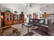 Inviting living room featuring tile floors, comfortable leather furniture, and neutral wall colors at 5458 Jessamine Ave, North Port, FL 34291
