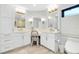 Bright bathroom with double sinks, vanity, and modern finishes at 562 Silk Oak Dr, Venice, FL 34293
