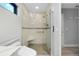 Bright bathroom featuring a shower with clear glass enclosure at 562 Silk Oak Dr, Venice, FL 34293