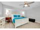Bright bedroom features a ceiling fan and a cozy rug at 562 Silk Oak Dr, Venice, FL 34293