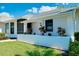 Inviting home exterior with a decorative front planter and lush landscaping, creating a welcoming curb appeal at 562 Silk Oak Dr, Venice, FL 34293