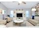 Relaxing living room showcasing modern decor, cozy seating, a ceiling fan, and a chic entertainment center at 562 Silk Oak Dr, Venice, FL 34293