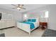 Serene main bedroom with a plush bed, ample natural light, and elegant furnishings at 562 Silk Oak Dr, Venice, FL 34293