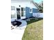 Well-maintained backyard with a patio, garden beds, and partial fence at 599 Carmel Rd, Venice, FL 34293
